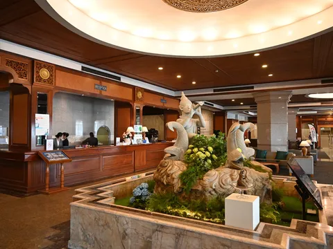 Polished timber hotel reception desk