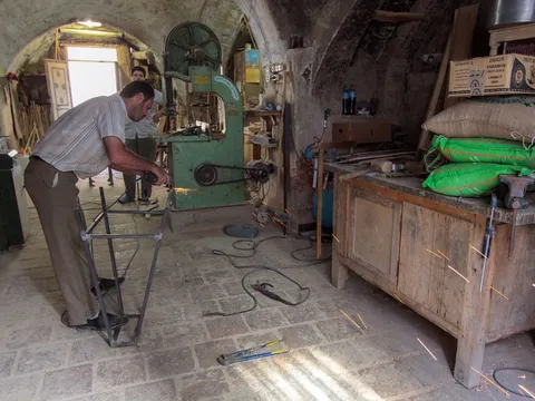 Joiner working on workshop machinery